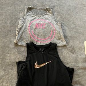 Two Nike dry-fit tanks